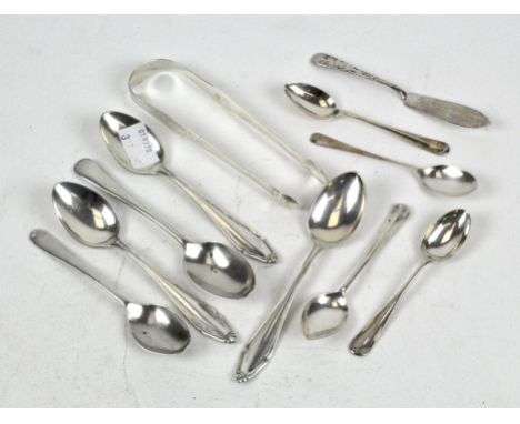 A mix of silver flatware, comprising mostly teaspoons, Georgian bright cut sugar tongs and more, silver weight approximately 