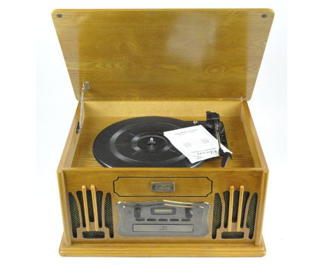 A 'Classic' collectors edition record, cassette, and CD player, model: C537/9809, with the instruction booklet, height 24cm.