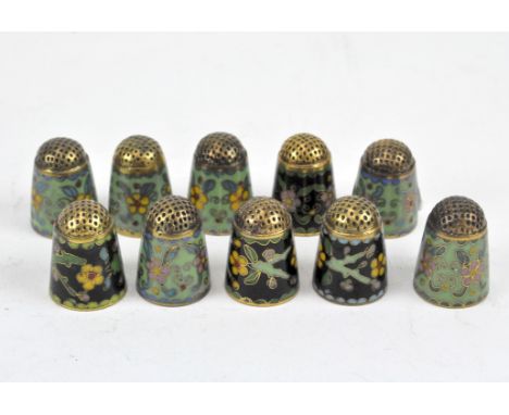 A collection of ten cloisonne enamel thimbles, each adorned with traditional decorations of flora and fauna.