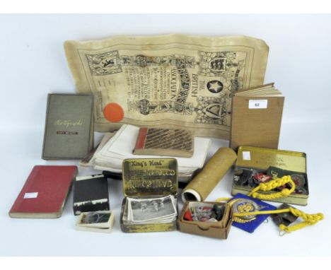 Early 20th century Scout related memorabilia, including photographs, badges, a certificate and a compass