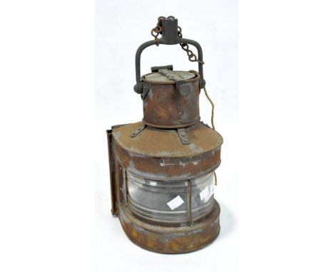 A ship's copper masthead lamp, bearing plaque marked 'Masthead Patt.25A', height 41cm.