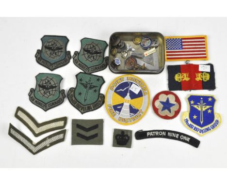 A collection of military and other badges and fabric patches, to include an enamel "forewarned is forearmed Observer Corb" ba