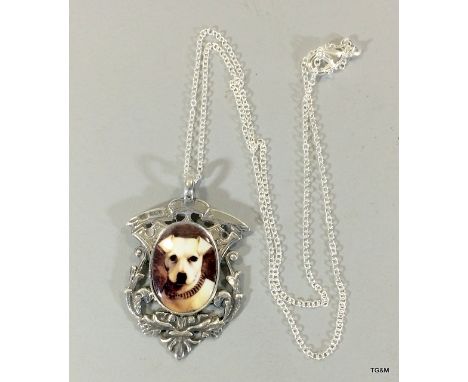 silver fob on chain with pictorial enamel image of a dog
