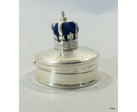 A silver pin cushion in the form of a crown with ring box to the base