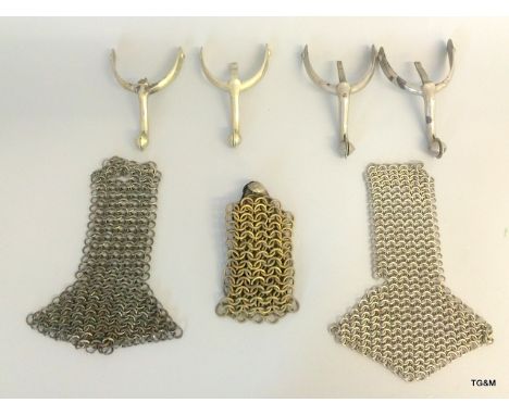 Two pairs of military spurs and three chain mail epaulettes
