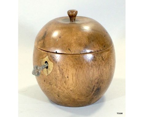 A novelty wooden tea caddy in the form of an apple