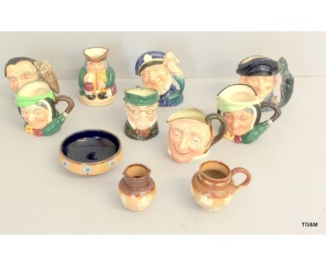 A collection of Royal Doulton Toby Jugs and A Royal Doulton/Lambeth salt glaze jug, pitcher and bowl with a Royal Doulton 'Fa