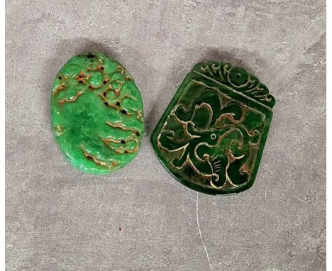 Two Chinese jade amulet pendants, the oval amulet carved with monkeys on a rocky outcrop, yhe larger with archaic beast (2) 5