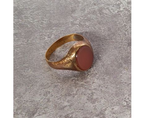 A 22ct gold signet ring set with an oval cornelian 4.27g gross; 