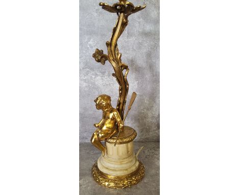 Lighting - an early 20th century gilt metal and alabaster table lamp base in the form of a cherub under a tree 