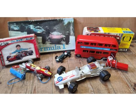 A 1960's boxed Bandai R/C 7-7579remote control Lotus F1 car, red tinplate body, Japanese market box; a Lincoln International 