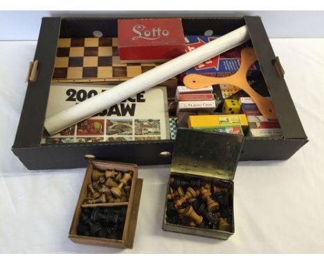 A box of vintage and modern games and playing cards. To include wooden chess pieces and Lotto game.