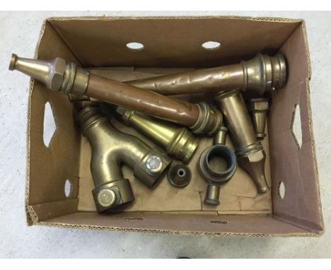A box of vintage brass and copper fire engine hose ends and findings