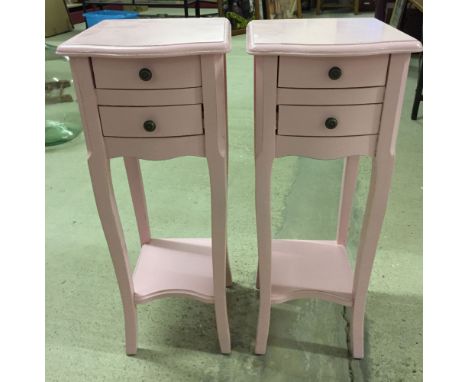 A pair of pink side tables with shelf and 2 drawer. Approx 66 x 26cm.