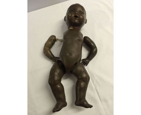 Vintage black German doll by Pomsons with bisque head and composition body. Needs restringing, some wear to head and body. Ap