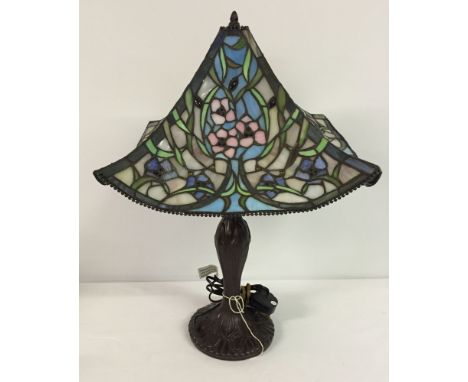 A modern Tiffany style lamp with leaded glass shade.