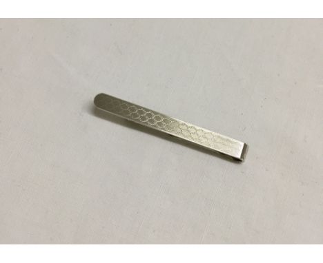 Hallmark silver tie bar with engine turned engraving.