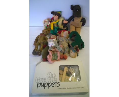 A collection of c1950s soft toys with a modern puppet kit.