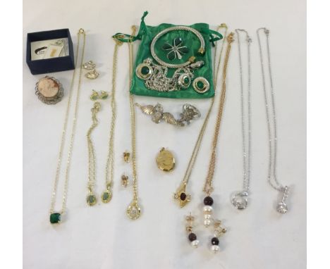 A quantity of costume jewellery to include, a cameo brooch, bangle and necklace & earring sets.