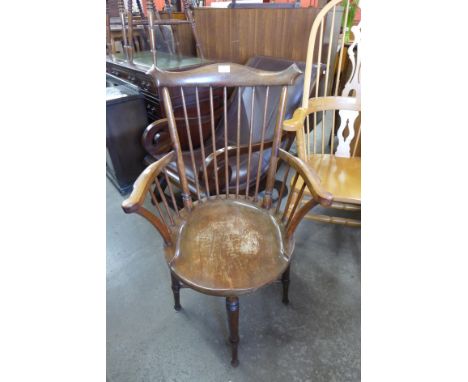 A mahogany comb back Windsor elbow chair 