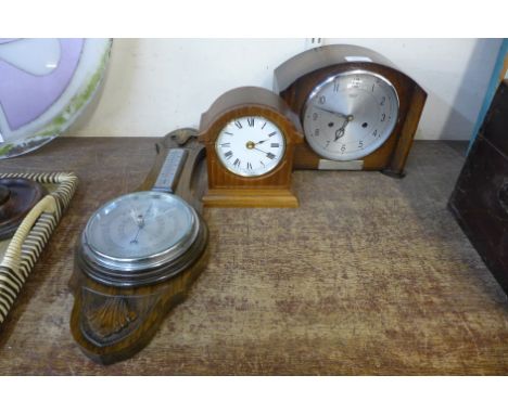 A Smiths oak mantel clock, an oak aneroid barometer and another small timepiece 