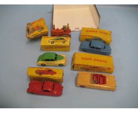 Four various boxed Dinky die-cast metal model cars, 159, 172, 132 and 157 together with a boxed Field Marshall tractor (all b