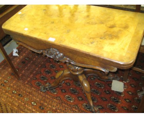 Victorian burr walnut D-shaped fold-over card table having baize lined interior on a turned tapering and carved column and fo