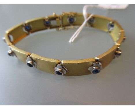 18ct Gold and cabochon sapphire set panel design bracelet