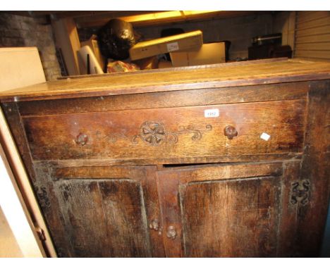 Small early 20th Century oak dresser with boarded shelf back above a drawer and cupboard doors