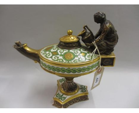 19th Century Continental porcelain pedestal ewer in the form of an oil lamp, the body decorated in green and gilt with neo cl