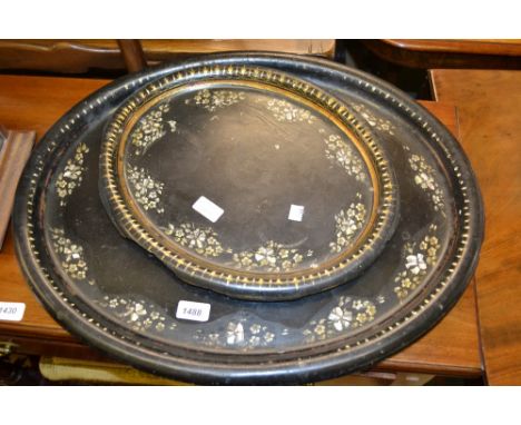 19th Century black lacquered papier mache and mother of pearl inlaid oval tray (a/f) together with a similar smaller tray