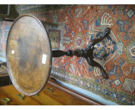 Circular mahogany tray top occasional table on a turned column support with carved tripod