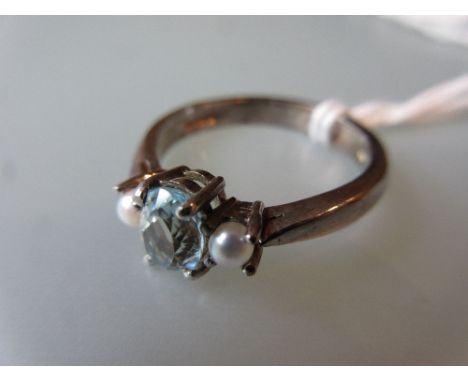 9ct White gold blue zircon and pearl set ring