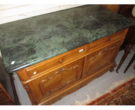 19th Century Continental satin birch buffet, the green variegated marble top above two drawers and two panel doors on low car