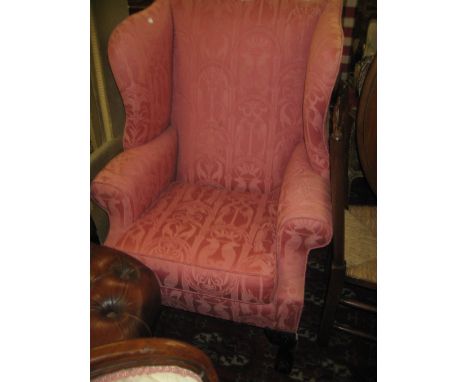 20th Century pink damask upholstered wing back armchair on carved cabriole claw and ball front supports