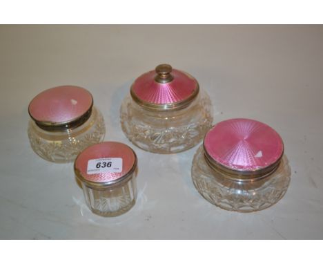 Group of four silver and pink enamel mounted dressing table bottles (a/f)