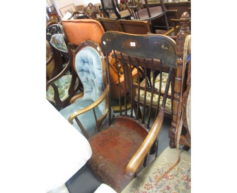 19th Century American stickback rocking elbow chair with a moulded panel seat on turned supports