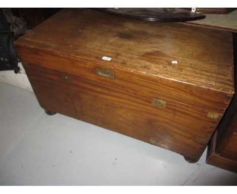 19th Century camphor wood trunk having brass straps, two lock plates and carrying handle on later turned bun supports, 41ins 