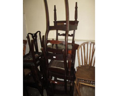 Set of six George IV mahogany dining chairs, the bar backs with carved centre rails above curved panel seats and turned taper