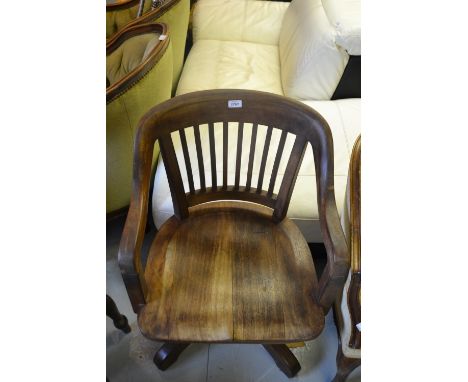 Early 20th Century mahogany tub shaped adjustable swivel office armchair with slatted back, sprung seat and adjustable height