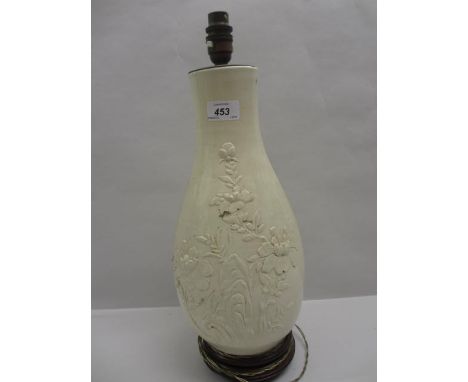 Chinese blanc de chine relief decorated baluster form vase adapted for use as a table lamp