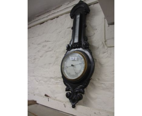 Late Victorian carved oak aneroid barometer thermometer
