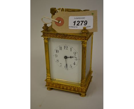 Small brass cased carriage clock with enamel dial, Arabic numerals and single train movement (slight damage)