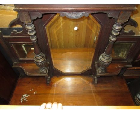 19th Century walnut chiffonier having bevel edged, mirrored and shelved top above two short drawers and two carved panel door