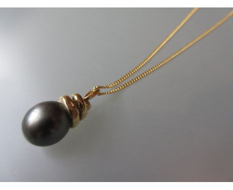 18ct Gold black cultured pearl and diamond set pendant on chain