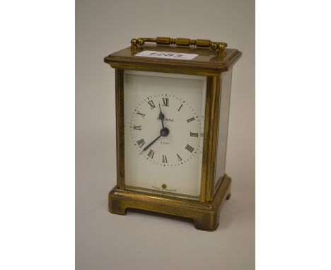 Small brass cased carriage clock, the enamel dial with Roman numerals, signed Bayard, with a single train fixed key wind move