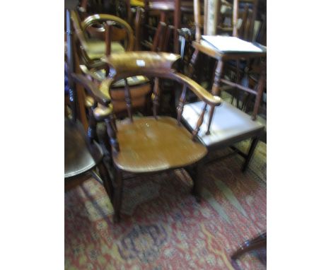 19th Century beech and elm bow back elbow chair with spindle back, panel seat and turned supports