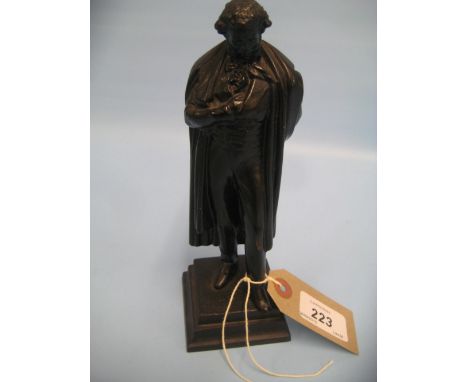 20th Century Russian cast iron figure of a gentleman in a cloak