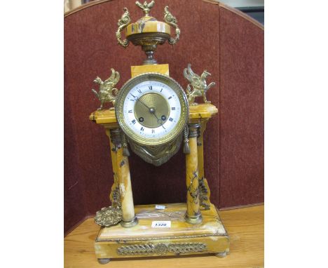 French variegated marble and gilt metal portico clock with urn surmount, the circular enamel dial with Arabic and Roman numer