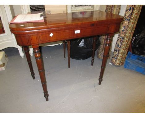 George III mahogany crossbanded and black line inlaid rectangular fold-over card table on turned tapering supports